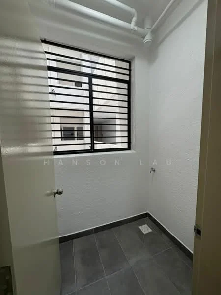 Laundry features: white painted walls, grey tile flooring, black metal window with horizontal slats, single drainage outlet on floor, exposed plumbing pipes.