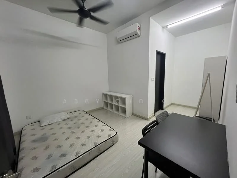 Bedroom features: single mattress on bed frame, white painted walls, light wood flooring, 1 wall-mounted split AC, ceiling fan, black study desk, black chair, open shelving unit, door leading to hallway, window with no visible treatment; style: minimalist.