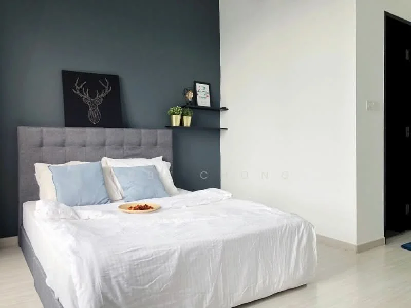 Bedroom features: king-size bed with grey upholstered headboard, white bedding, two blue decorative pillows, wall-mounted shelf, decorative plant on shelf, framed artwork with deer motif, light grey walls, dark grey accent wall, laminate flooring, door to hallway; style: modern.