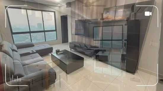 Living features: L-shape sectional sofa in grey, coffee table in black, TV console with built-in storage, wall-mounted TV, floor-to-ceiling windows, white painted walls, recessed downlights, glossy tile flooring, decorative wall paneling, area rug, decorative plants; style: modern; view: city.