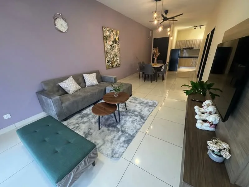 Living features: grey fabric sofa, 2 round wooden coffee tables, area rug with geometric pattern, wall-mounted TV, wooden TV console, decorative wall art, clock on wall, ceiling fan with light, white tiled flooring, green upholstered ottoman, houseplants in ceramic pots; style: modern. Dining features: 4-seater dining table, dark wooden dining chairs; style: modern. Kitchen features: kitchen cabinetry, countertop, stainless-steel sink, built-in appliances; style: modern.