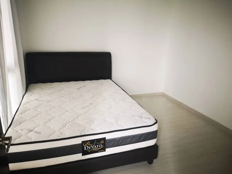 Bedroom features: queen-size bed, black upholstered bed frame, white mattress, light grey walls, light wood flooring, floor-to-ceiling window, sheer curtains; style: minimalist.