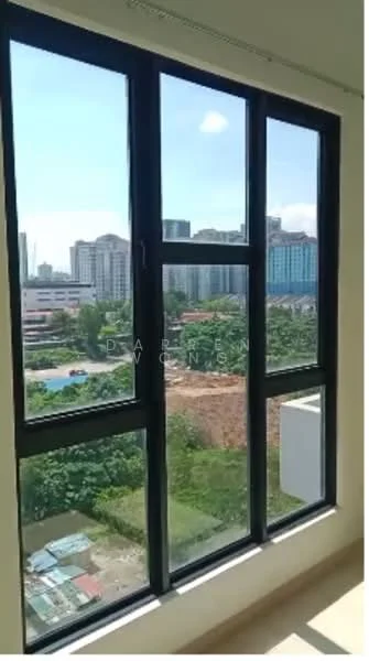 Room features: floor-to-ceiling windows, black window frames, city view, natural light, greenery visible outside, urban landscape, clear blue sky; view: city.