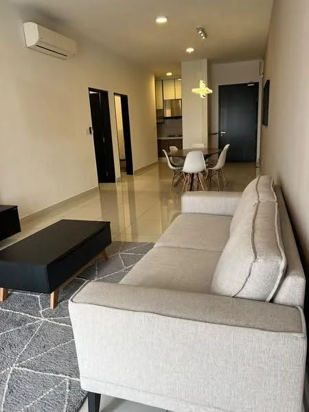 Living features: 3-seater fabric sofa in light grey, coffee table with black surface and wooden legs, area rug with geometric pattern, wall-mounted air conditioning unit, recessed ceiling lights, pendant light fixture, large windows with natural light, tile flooring, neutral painted walls; style: modern. Dining features: 4-seater dining table, white plastic dining chairs, neutral painted walls, tile flooring; style: modern. Kitchen features: kitchen cabinetry with upper and lower storage, countertop with space for appliances, tile flooring, neutral painted walls; style: modern.