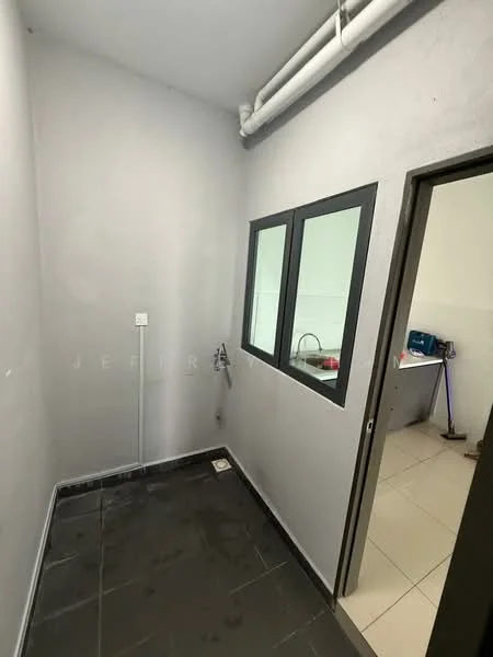 Room features: grey painted walls, black tiled flooring, single window with black frame, door with black frame, plumbing fixtures visible, light fixture on ceiling, no visible furniture or decor; style: minimalist.