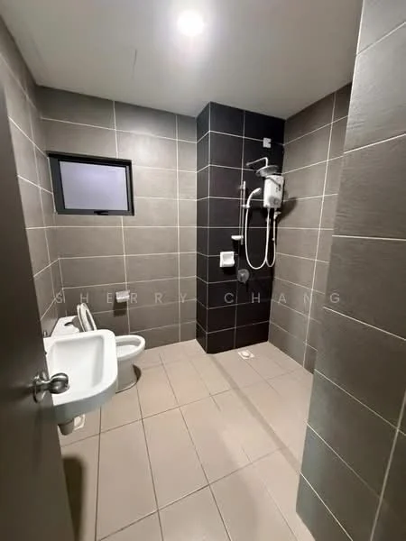 Bathroom features: grey tiled walls, light beige tiled flooring, toilet, bidet spray, shower area with wall-mounted showerhead, water heater, small window, wall-mounted soap holder; style: modern.