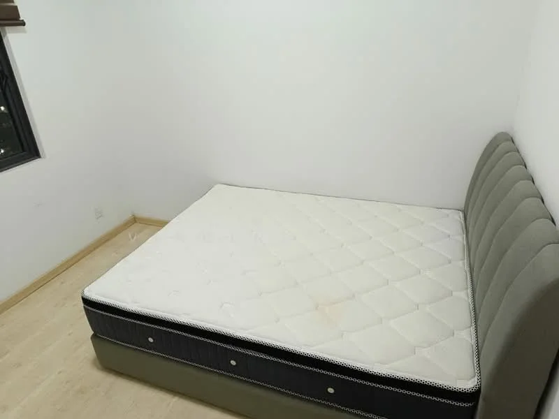 Bedroom features: queen-size bed, upholstered headboard, light wood flooring, white painted walls, window with black frame, no visible curtains, minimal decor; style: minimalist.