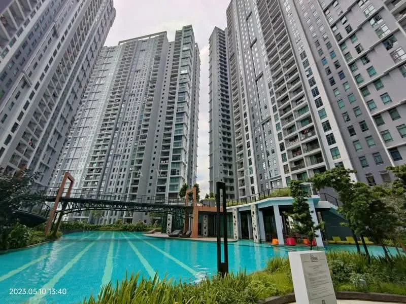 Exterior type: high-rise condominium; features: swimming pool, pool deck with loungers, landscaped garden, water feature, multiple high-rise buildings, walkway bridge, modern architectural design, greenery surrounding pool area; style: modern.