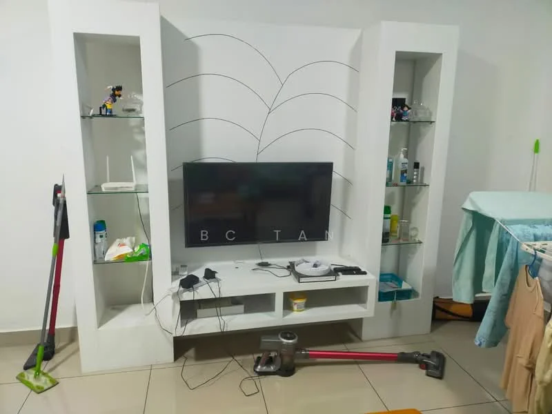 Living features: white built-in entertainment unit, flat-screen TV, shelves with decorative items, ceramic tile flooring, vacuum cleaner, cordless vacuum, light blue fabric sofa, laundry drying rack, wall with minimal decor, neutral wall color; style: modern.