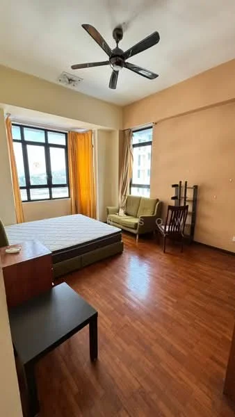 Bedroom features: wooden flooring, cream painted walls, floor-to-ceiling windows, yellow curtains, 3-blade ceiling fan, double bed frame without mattress, green fabric sofa, wooden chair, black side table, open shelving unit; style: modern; view: city.
