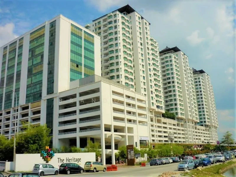 Exterior type: high-rise condominium; features: glass curtain wall, white painted facade, multiple storeys, balconies on upper floors, parking deck, landscaped entrance, signage at entrance, surrounded by greenery; style: modern.