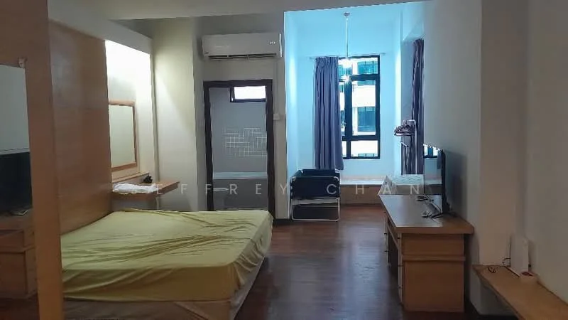 Bedroom features: queen-size bed with yellow bedding, wooden bed frame, 2 wooden bedside tables, wall-mounted TV, wooden TV console, air conditioning unit, large window with sheer curtains, dark curtains, wooden flooring, recessed ceiling lights, mirror on wall, study desk, chair; style: modern.