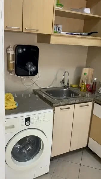 Kitchen features: single-bowl stainless-steel sink, chrome pull-down faucet, granite countertop, wood cabinetry in light color, built-in washing machine, shelf above sink, wall-mounted fan, tile flooring, bottle of dish soap, cleaning supplies, cutting board; style: modern.
