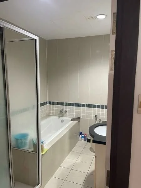 Bathroom features: bathtub, shower enclosure, single-sink vanity, chrome faucet, tile flooring, wall tiles, mirror above vanity, built-in storage, light fixture, toiletries on countertop; style: modern.