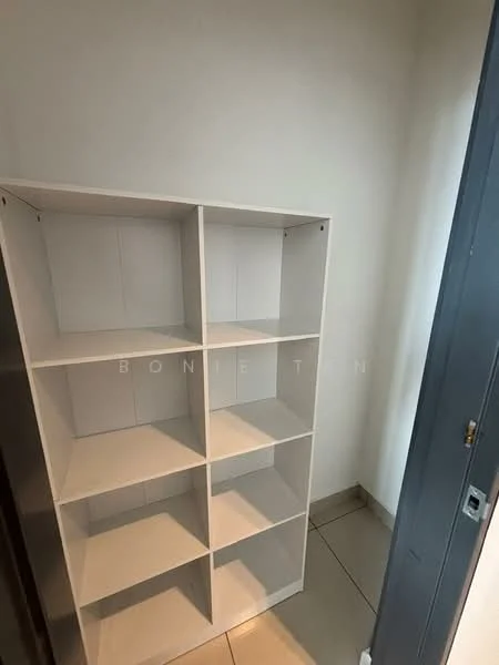 Room features: white shelving unit with six compartments, light grey tiled flooring, plain white walls, door frame visible, corner of the room; style: minimalist.