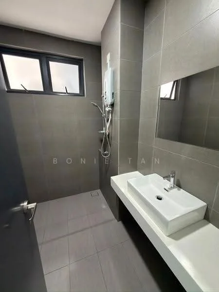 Bathroom features: grey tiled walls, grey tiled flooring, wall-mounted shower with handheld showerhead, chrome shower valve, white rectangular sink, chrome basin mixer faucet, large mirror above sink, small window for natural light, built-in wall-mounted water heater; style: modern.