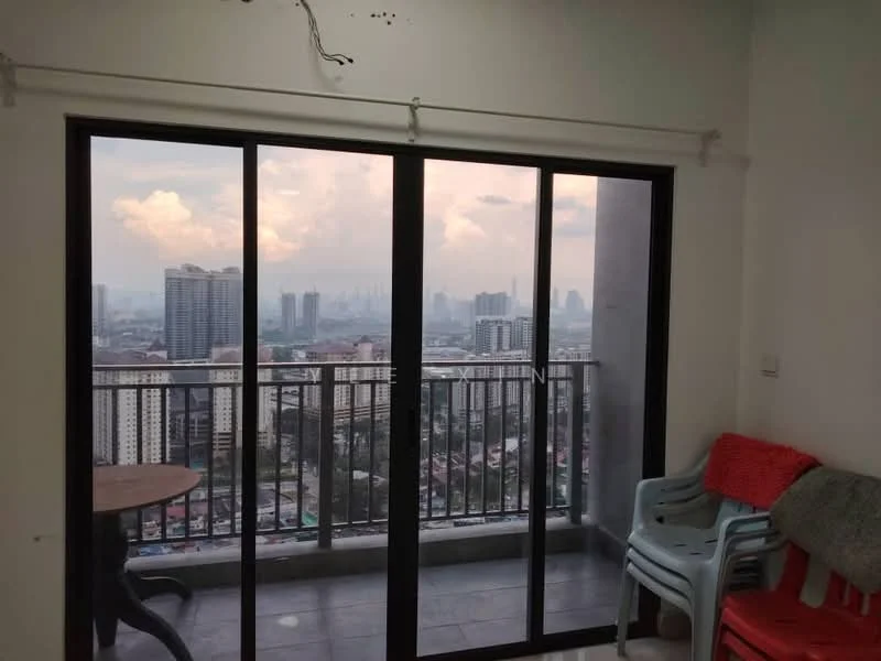 Room features: floor-to-ceiling sliding glass door, city skyline view, grey tiled flooring, white painted walls, balcony railing, plastic chairs, red blanket, wall-mounted curtain rod; view: city.