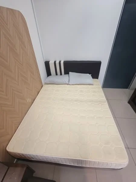Bedroom features: queen-size bed, upholstered headboard, two pillows, light-colored mattress, wooden headboard with herringbone pattern, grey wall behind bed, tile flooring, built-in wardrobe, dark wood bedside table; style: modern.