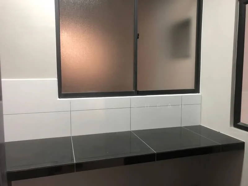 Room features: black countertop, white tiled backsplash, window with frosted glass, black window frame, plain painted walls.