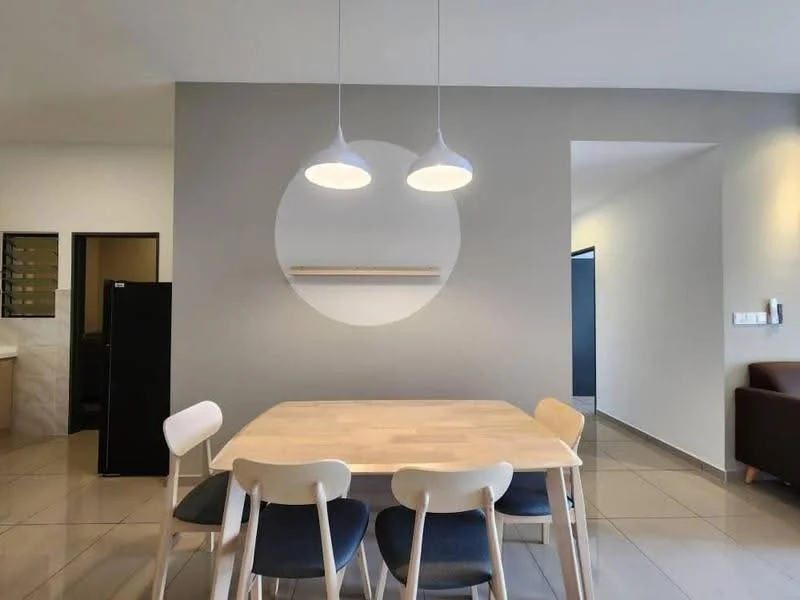 Dining features: wooden dining table, 4 dining chairs with light wood legs and dark cushions, 2 pendant lights hanging from the ceiling, grey painted walls, large circular wall feature, tile flooring, open layout to adjacent rooms; style: modern. Room features: black refrigerator, doorway leading to another room.
