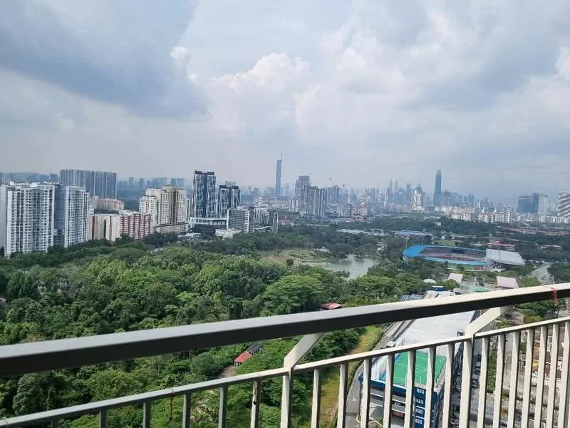 Exterior type: high-rise condominium; features: city skyline view, surrounded by greenery, near water body, modern architecture, balconies visible, urban landscape, cloudy sky, multiple high-rise buildings; style: modern.