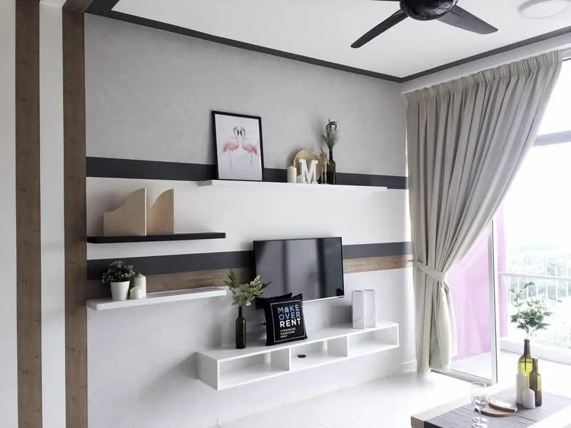 Living features: light grey painted walls, white ceiling, 5-blade ceiling fan in black, floor-to-ceiling windows, curtains in light beige, white floating shelves, black wall-mounted TV, decorative plants on shelves, framed artwork, decorative sign on shelf, wood accent wall, white tiled flooring; style: modern; view: city.