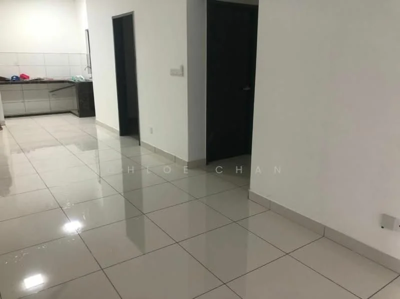 Room features: white painted walls, glossy ceramic tile flooring, dark wooden door, light switch, kitchen area visible in background, open layout, neutral color scheme, no visible furniture; style: modern.