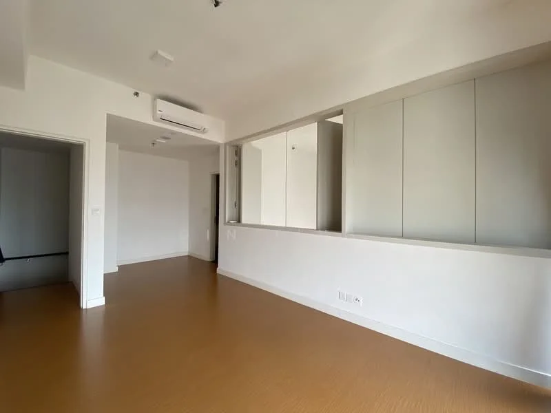 Room features: light wood laminate flooring, white painted walls, recessed downlights, wall-mounted split AC, large mirror, built-in cabinetry, open layout, neutral color palette; style: modern.