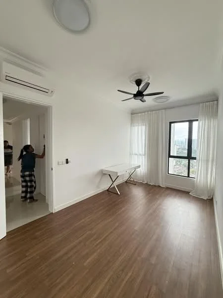 Room features: white painted walls, laminate flooring, 5-blade ceiling fan, floor-to-ceiling window, sheer curtains, folding table, air conditioning unit, natural light from window; style: modern; view: city.