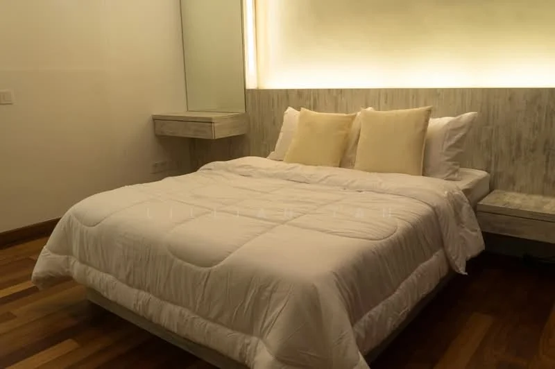 Bedroom features: king-size bed with white bedding, two beige decorative pillows, wooden bed frame, nightstand with drawer, wall-mounted mirror, recessed lighting behind headboard, wooden flooring, neutral wall color; style: modern.