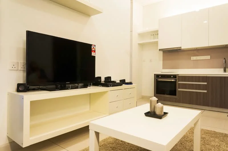 Living features: black flat-screen TV, white TV console, dark wood cabinetry, built-in oven, stainless-steel sink, chrome faucet, white countertop, cream tiled flooring, recessed lighting, decorative candles, area rug, open shelving; style: modern.