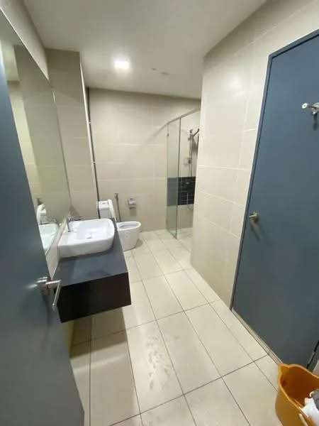 Bathroom features: white ceramic toilet, single-sink vanity with rectangular basin, chrome basin mixer faucet, glass shower enclosure, walk-in shower with rain shower head, grey tiled walls, light-colored floor tiles, mirror above vanity, sliding door, built-in shelving, towel hook; style: modern.
