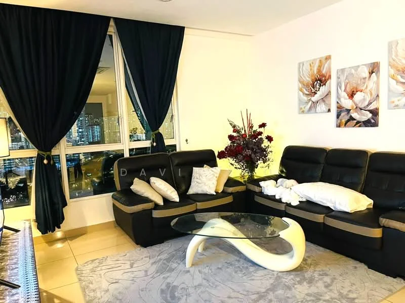 Living features: black leather sectional sofa, glass coffee table with white base, decorative throw pillows, framed floral artwork on walls, dark curtains, cream area rug, floor-to-ceiling windows, city view through windows, indirect lighting, decorative flower arrangement; style: modern; view: city.