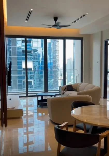 Living features: large floor-to-ceiling windows, city skyline view, 3-seater fabric sofa in cream, coffee table, wall-mounted TV, recessed downlights, 5-blade ceiling fan, polished marble flooring, decorative wall paneling, open layout, area rug, dining table with chairs; style: modern; view: city.