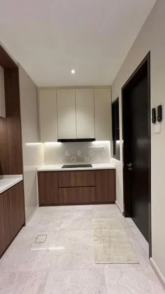 Kitchen features: white cabinetry with flat-panel doors, brown wood lower cabinets, black built-in oven, black cooktop, white countertop, marble tile flooring, recessed LED downlights, single-bowl stainless-steel sink, chrome pull-down faucet, wall-mounted range hood, neutral wall color, window with black frame, area rug, two wall-mounted switches; style: modern.