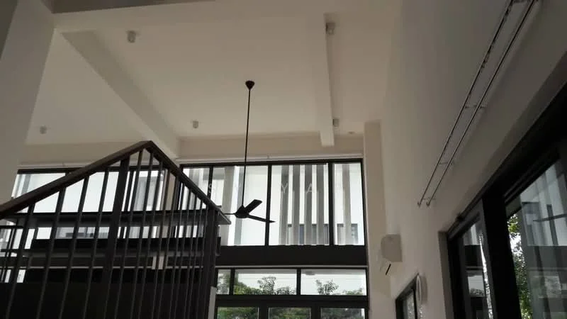 Room features: high ceiling, exposed beams, ceiling fan, large windows, sliding glass door, black metal railing, white painted walls, air conditioning unit; style: modern; view: garden.