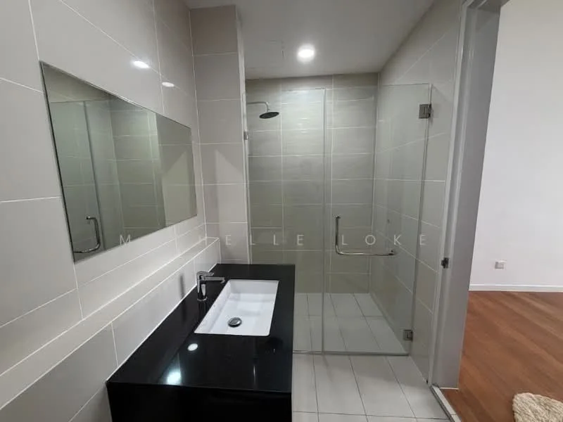 Bathroom features: single-sink vanity with black countertop, chrome basin mixer faucet, large wall-mounted mirror, glass shower enclosure, rain shower head, white tiled walls, grey tiled flooring, recessed downlights; style: modern.