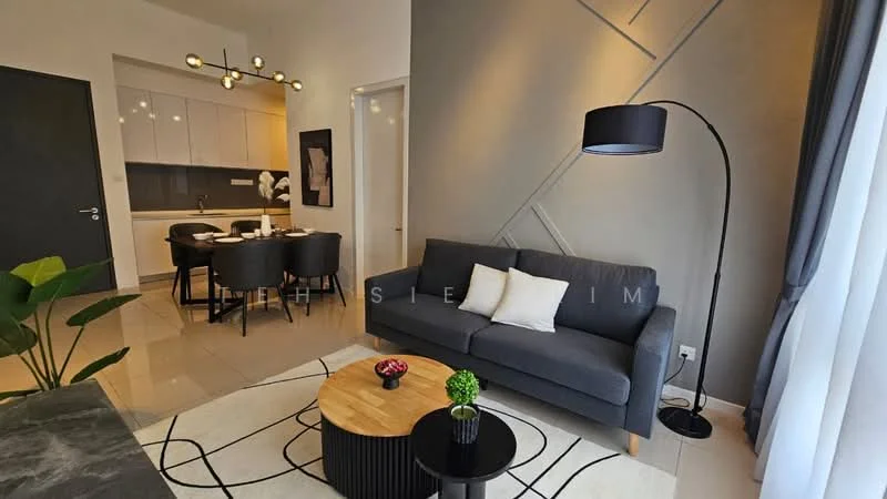 Living features: grey fabric sofa, round wooden coffee table, area rug with geometric pattern, floor lamp with black shade, wall-mounted artwork, potted plant, light-colored walls, tile flooring, recessed ceiling lights; style: modern. Dining features: 4-seater dining table, black dining chairs, white cabinetry in kitchen area, open kitchen layout; style: modern.