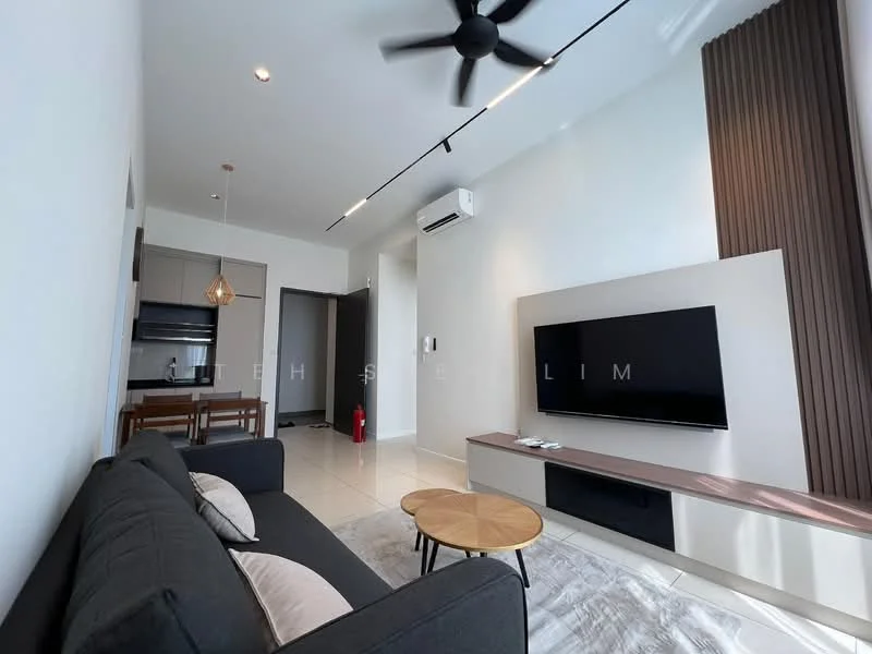 Living features: 3-seater fabric sofa in dark grey, coffee table with wooden top, wall-mounted TV, TV console with storage, recessed downlights, ceiling fan, cream painted walls, tile flooring, decorative wall paneling, open layout to kitchen, fire extinguisher visible; style: modern. Kitchen features: kitchen island with seating, stainless-steel sink, built-in oven, stainless-steel range hood, 4-burner gas hob, microwave, cabinets with flat-panel design, refrigerator, tile backsplash; style: modern.