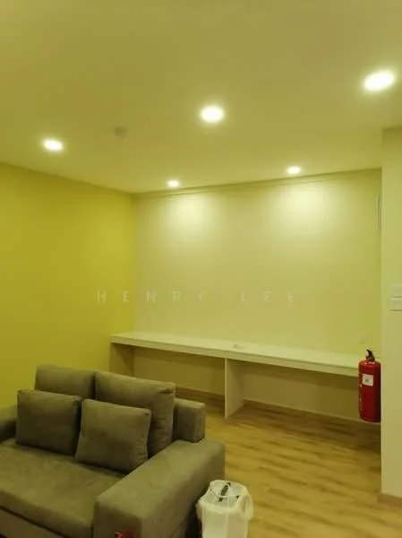 Room features: light yellow painted walls, laminate flooring, recessed LED downlights, sofa with cushions in grey, white countertop, fire extinguisher, plastic bag on the floor; style: modern.