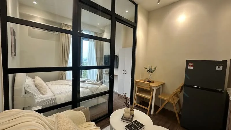 Bedroom features: floor-to-ceiling windows, white curtains, queen-size bed with white bedding, wall-mounted TV, light wood flooring, air conditioning unit, built-in wardrobe with sliding doors; style: modern; view: city. Living features: small dining table with two chairs, refrigerator, decorative vase on table, light wall paint, wooden flooring; style: modern; view: city.
