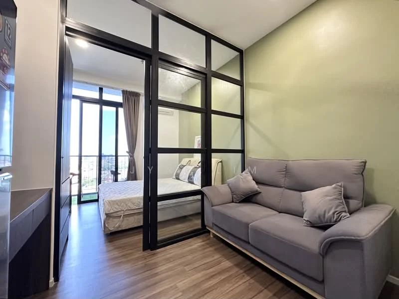 Living features: grey fabric sofa with cushions, wooden flooring, green painted walls, floor-to-ceiling windows, sheer curtains, air conditioning unit, glass partition, decorative wall art; style: modern; view: city. Bedroom features: queen-size bed, bedding with decorative pillows, wooden flooring, floor-to-ceiling windows, sheer curtains; style: modern; view: city.