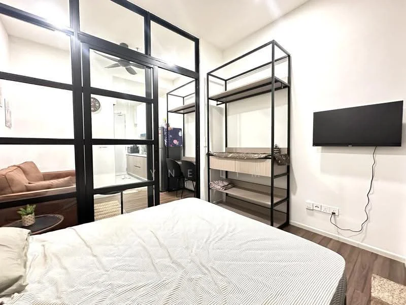 Bedroom features: queen-size bed with light bedding, black metal bed frame, built-in wardrobe with sliding doors, open shelving unit with decorative items, wall-mounted TV, ceiling fan, wooden flooring, white painted walls, decorative wall clock; style: modern. Living features: brown fabric sofa, area rug, coffee table, white painted walls; style: modern. Bathroom features: glass shower enclosure, white tiled walls, modern sink with faucet, mirror above sink; style: modern.