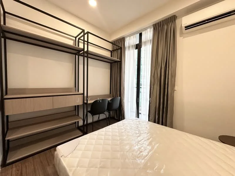 Bedroom features: single bed with mattress, metal bed frame, built-in study desk, open shelving unit, black metal shelving, curtains, floor-to-ceiling window, air conditioning unit, laminate flooring, neutral wall color; style: modern.