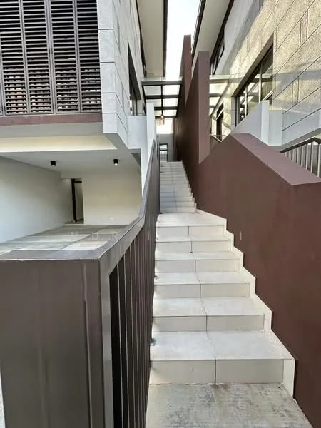 Exterior features: staircase with white stone steps, brown accent wall, glass railing, exposed concrete wall, horizontal wooden slats, landscaped pathway, outdoor lighting fixtures, modern architectural design; style: modern.