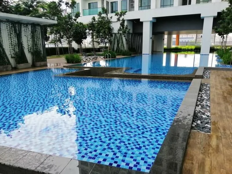 Exterior type: swimming pool deck; features: infinity pool with mosaic tiles, shallow area for lounging, landscaped garden with greenery, poolside loungers, stone-paved walkway, decorative water feature, surrounding trees, wooden deck area; style: modern.