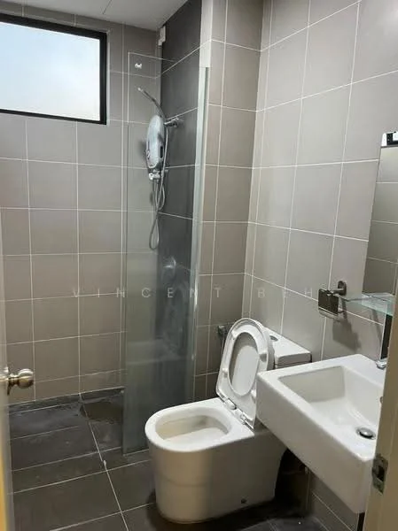 Bathroom features: grey tiled walls, white ceramic floor tiles, walk-in shower with glass enclosure, rain shower head, toilet with dual flush, white sink with modern faucet, mirror above sink, small window for natural light; style: modern.