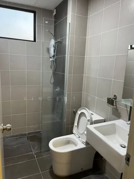 Bathroom features: grey tiled walls, grey tiled flooring, walk-in shower with glass enclosure, rain shower head, toilet, single-sink vanity, chrome basin mixer, framed mirror, exhaust fan, window for natural light; style: modern.