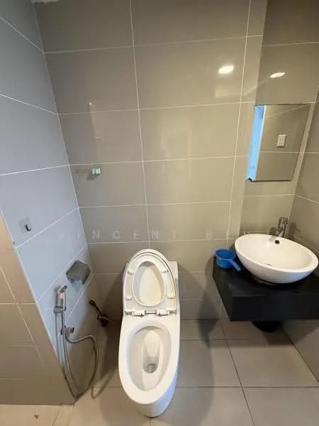 Bathroom features: wall-mounted toilet, bidet spray, single-sink vanity with black cabinet, round basin sink, chrome basin mixer faucet, full-height grey tile walls, grey tile flooring, framed mirror, recessed lighting; style: modern.