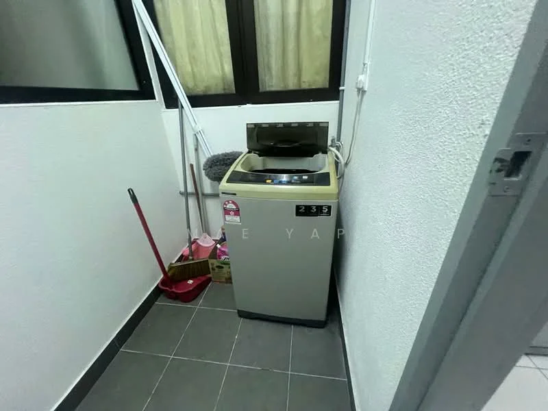 Laundry features: top-load washing machine in beige, grey tiled flooring, white painted walls, window with sheer curtains, cleaning supplies including broom and mop, small storage area, corner space.